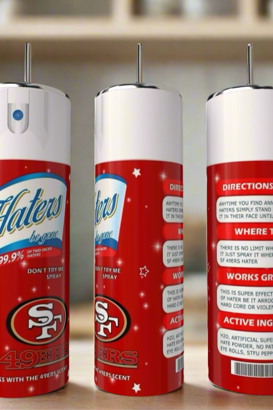 Three novelty spray cans with San Francisco 49ers logos sit on a kitchen counter next to a Kreative Kreationz SF 49ers Haters 20oz Tumbler. The cans display playful instructions and vibrant red, white, and blue designs.