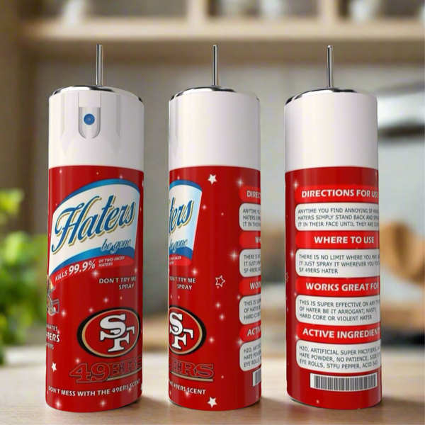 Three novelty spray cans with San Francisco 49ers logos sit on a kitchen counter next to a Kreative Kreationz SF 49ers Haters 20oz Tumbler. The cans display playful instructions and vibrant red, white, and blue designs.