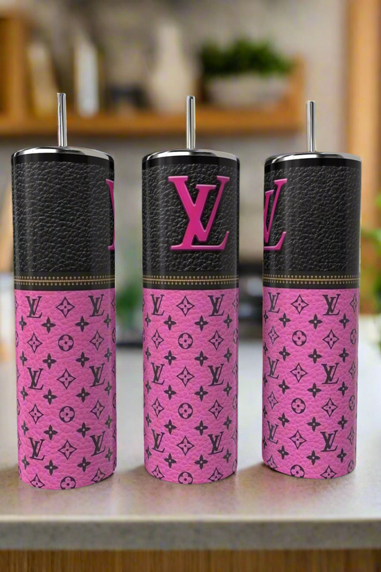 Three Kreative Kreationz LV 20oz Tumblers with metal straws, featuring black and pink Louis Vuitton-inspired designs, sit on a kitchen counter—stylish, eco-friendly drinkware for a luxe touch.