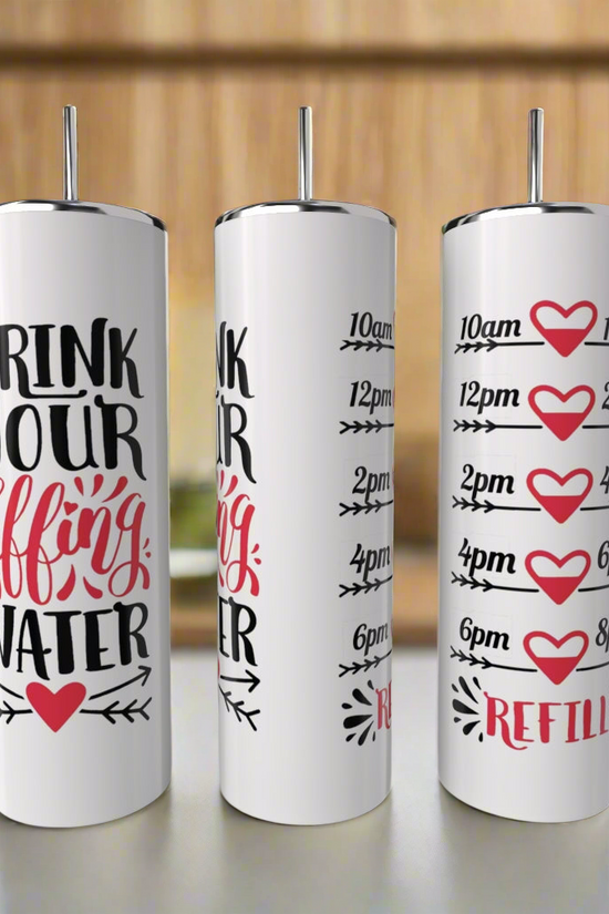 Three white Kreative Kreationz Drink Water 20oz Tumblers with reusable straws sit on a counter. Each features “Drink Your Effing Water,” cute red hearts, and a time-marked schedule to remind you to refill and stay hydrated all day.