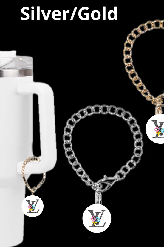 The Kreative Kreationz LV Charm Dangle features a white insulated tumbler adorned with a gold chain and a personalized pendant. Beside it are two lobster clasp chains, one gold and one silver, each with a round letter charm showcasing advanced electroplating technology.