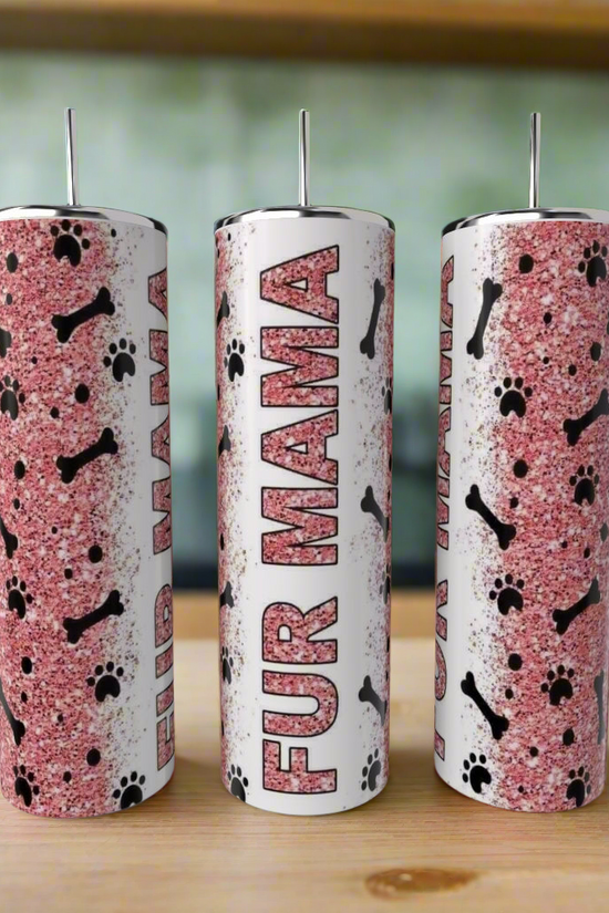 Three Kreative Kreationz Dog Mom 20oz Tumblers with white lids sit on a counter, featuring a pink glitter background, black dog bones and paw prints, and “FUR MAMA” vertically on the center customizable tumbler.