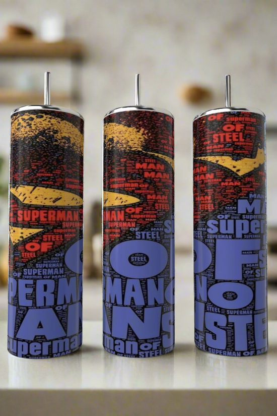 Three Kreative Kreationz Superman Man of Steel 20oz Tumblers with metal straws feature vibrant designs and text, displayed on a white kitchen countertop—ideal for fans seeking stylish, reusable drinkware.