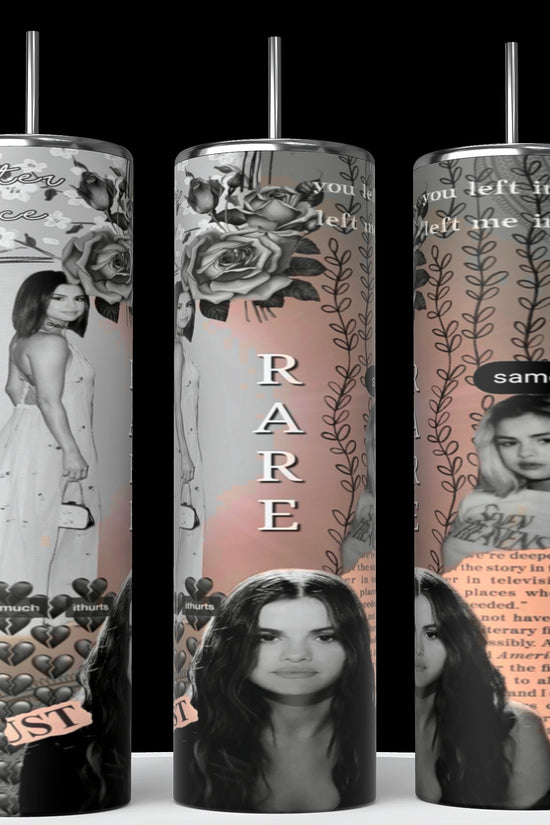Three tall tumblers are decorated with images of Selena Gomez in different poses; one in a white dress, one with a serious expression, and one in casual attire. The designs, reminiscent of intricate Stanley cups, are embellished with flowers, leaves, hearts, and text like 