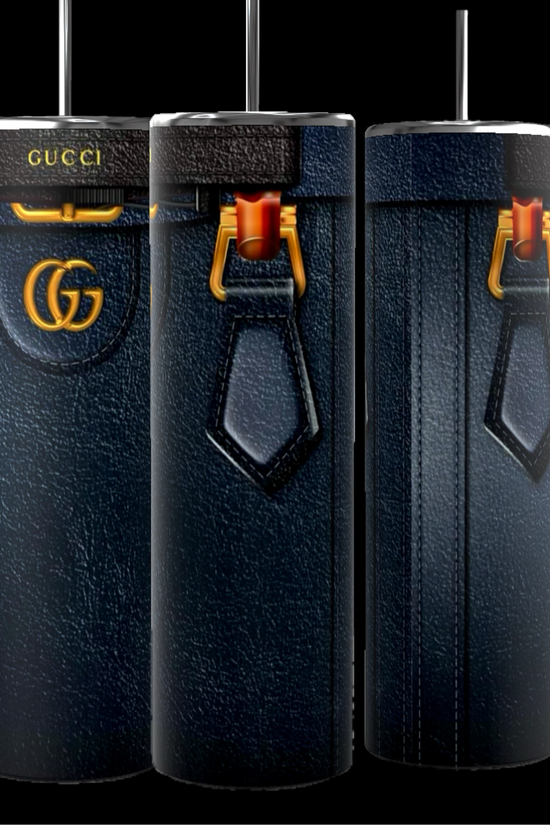 Three tall, cylindrical objects crafted to resemble luxury handbags and featuring a dark leather-like texture. These Kreative Kreationz Gucci Diana Purse 20oz tumblers are embellished with gold accents and signature patterns, and come with a spill-proof lid for added convenience.
