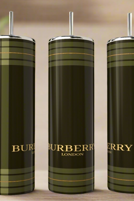 Three Burberry 20oz Skinny Tumblers by Kreative Kreationz are displayed with straws, showing a green and gold plaid pattern and logo. Add sophistication to your drinkware collection with these stylish stainless steel tumblers.