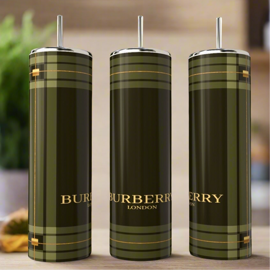 Three Burberry 20oz Skinny Tumblers by Kreative Kreationz are displayed with straws, showing a green and gold plaid pattern and logo. Add sophistication to your drinkware collection with these stylish stainless steel tumblers.