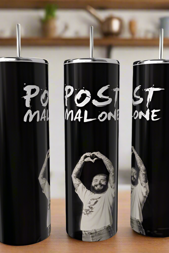 Three luxury-inspired Posty Tumblers, tall and black with metal straws, feature a person in a white shirt doing a heart gesture. 