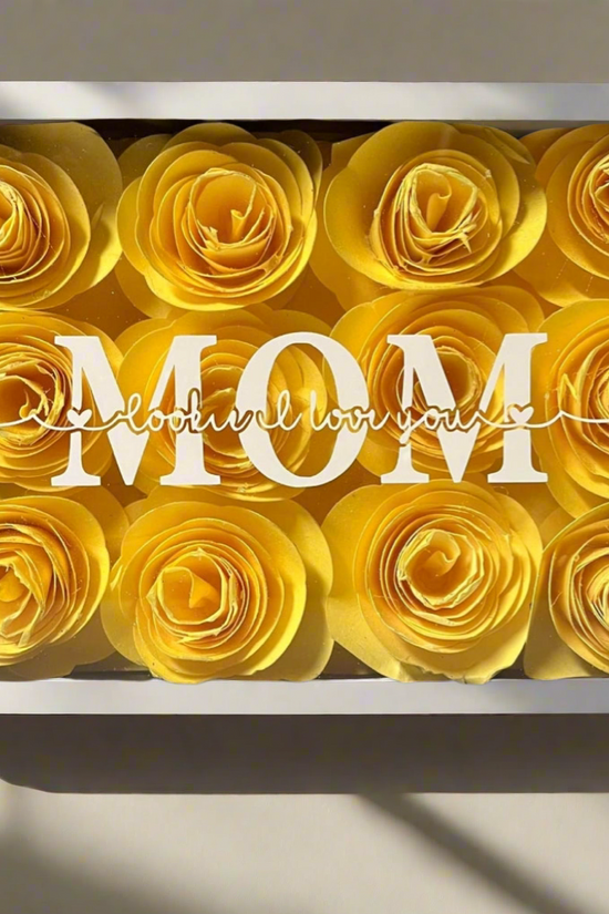 The Mom 5x7 Flower Shadow Box by Kreative Kreationz features yellow paper roses surrounding 