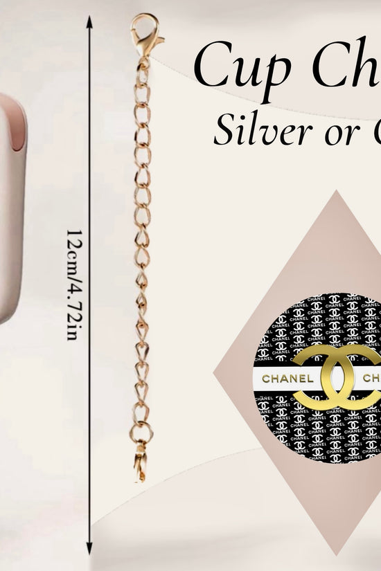 The Chanel Charm Dangle by Kreative Kreationz is a 12 cm handcrafted cup accessory in silver or gold. Featuring a black and white Chanel-inspired design, it hangs from a pale pink tumbler for a chic touch.