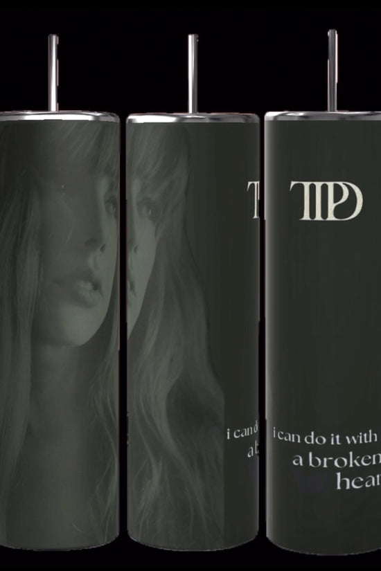 Three gray TTPD Lyrics 20oz Tumblers by Kreative Kreationz are displayed, each showcasing a black and white illustration of a thoughtful woman with long hair. Overlaid on the image is the text 