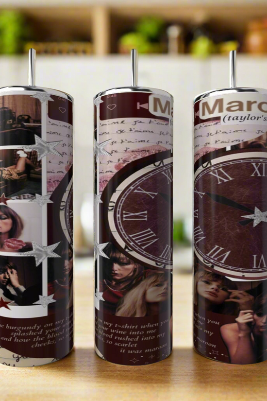 Three RED Taylor Swift 20oz Skinny Tumblers by Kreative Kreationz with straws are on a kitchen counter, featuring a collage design of dark clock faces, handwritten text, and photos of Taylor Swift in various poses.