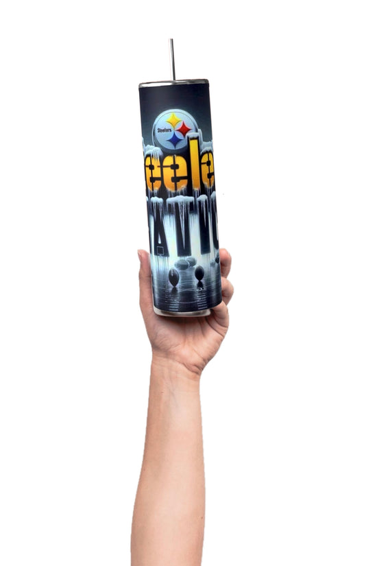 A hand holds a Kreative Kreationz Steelers Nation 20oz Skinny Tumbler featuring a vibrant football-themed design with 