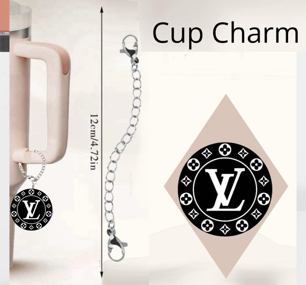 The LV Charm Dangle from Kreative Kreationz is a drinkware accessory featuring a black circle pendant with "VL". It elegantly hangs from a cup handle on a silver chain with clasps, measuring 12cm (4.72 inches).