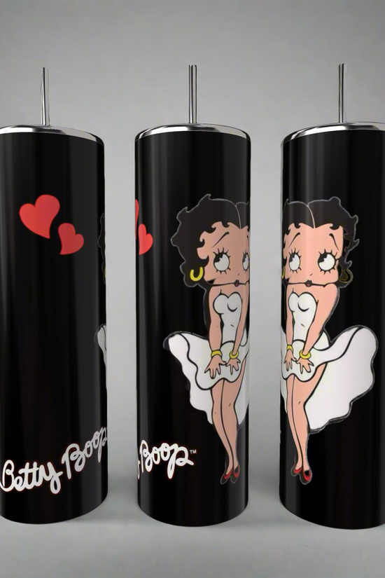 The Betty B White 20oz Skinny Tumblers by Kreative Kreationz feature the iconic black-haired Betty Boop in a white dress with red lipstick and hoop earrings. Red hearts adorn one tumbler, and 