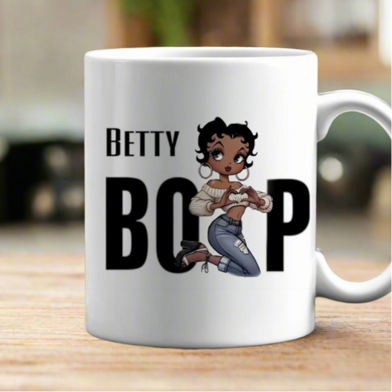 The Betty Boop Ceramic Mug by Kreative Kreationz is a white 11oz ceramic mug with 
