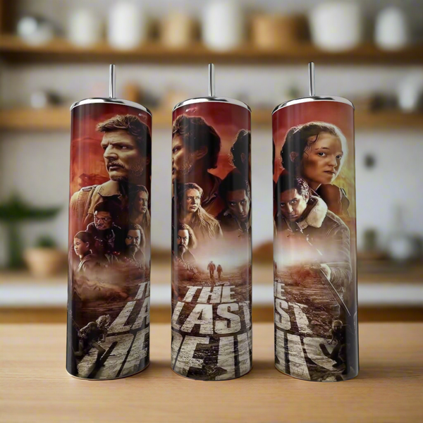 Three Kreative Kreationz "The Last Of Us (Season 1) 20oz Tumblers" sit on a kitchen counter, each showcasing series-inspired artwork of characters and dramatic scenes against a blurred kitchen background.