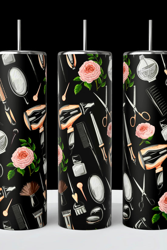 Kreative Kreationz's Hairstylist 20oz Tumblers feature black backgrounds adorned with styling tools like hairdryers, brushes, scissors, mirrors, and pink roses. Each tumbler includes a reusable silver straw and a spill-proof lid for style and convenience.