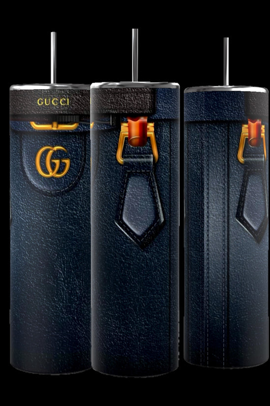 A trio of Gucci Diana Purse 20oz Tumblers from Kreative Kreationz, showcasing elegant leather-like exteriors with luxury branding and gold accents, along with a unique strap design and spill-proof lids, are beautifully displayed against a black background.