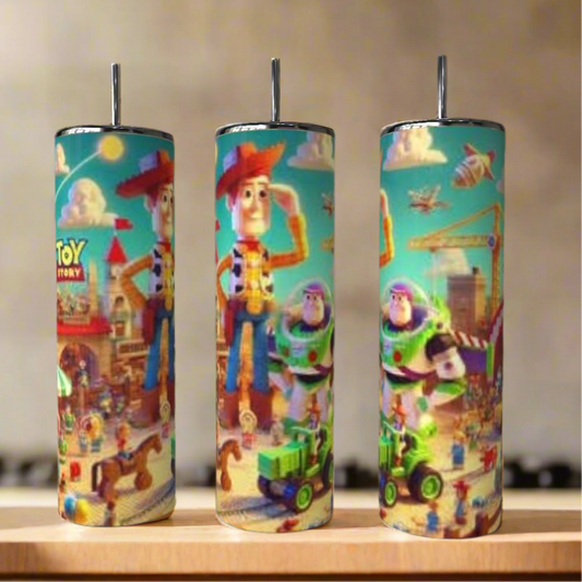 Three Kreative Kreationz Toy Story 20oz Tumblers with vibrant animation-style designs featuring Woody, Buzz Lightyear, and other favorite characters are displayed on a wooden surface.