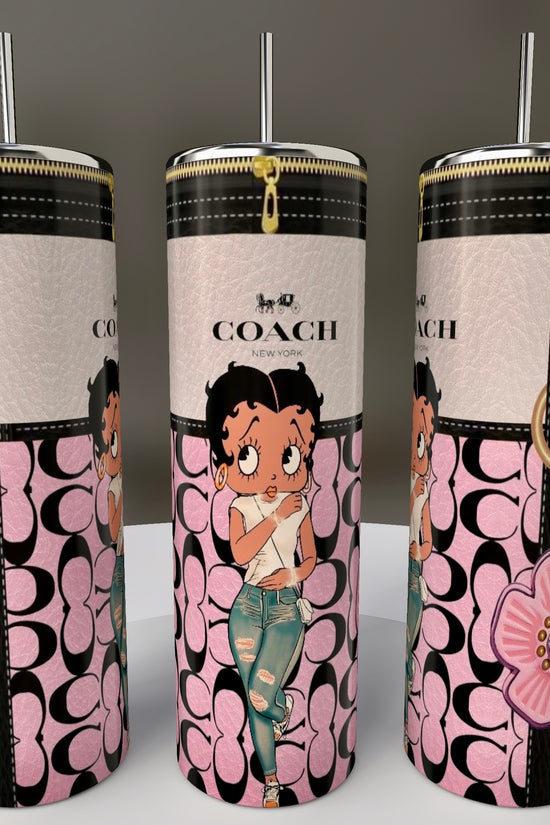Three stylish Kreative Kreationz Betty B Coach 20oz Skinny Tumblers feature classic Betty Boop cartoon prints with a pink floral pattern and Coach New York logo. Each includes a sublimated design, metal straw, spill-proof lid, and gold accents for a fun yet functional experience.