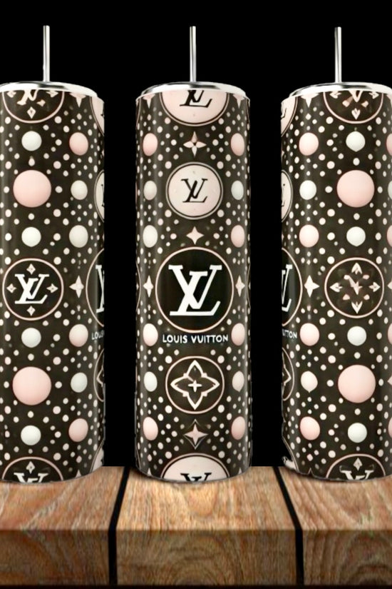 Three LV Pink & Black Abstract 20oz Tumblers by Kreative Kreationz, featuring stylish polka dot patterns and LV logos, stand on a wooden surface—luxury drinkware perfect for any chic setting.