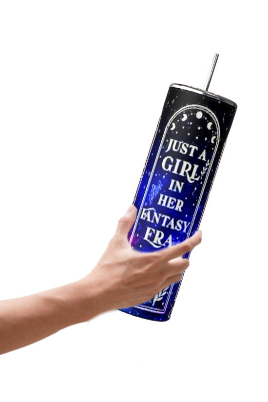 A hand holds the stylish Just a Girl 20oz Tumbler by Kreative Kreationz, featuring a dark blue design with a spill-proof lid and straw. The tumbler is decorated with stars and the phrase 