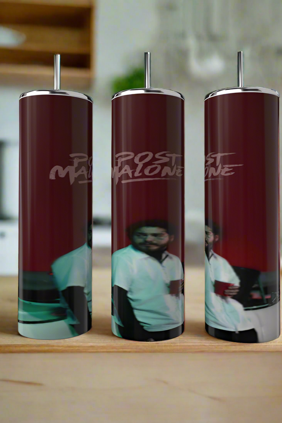 On a wooden surface are three tall cylindrical tumblers of the Kreative Kreationz brand, from the 