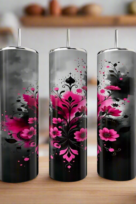 Three Kreative Kreationz Aesthetic Smokey Flowers 20oz stainless steel tumblers with lids and straws, featuring black and gray floral designs, sit on a kitchen counter with shelves softly blurred in the background.