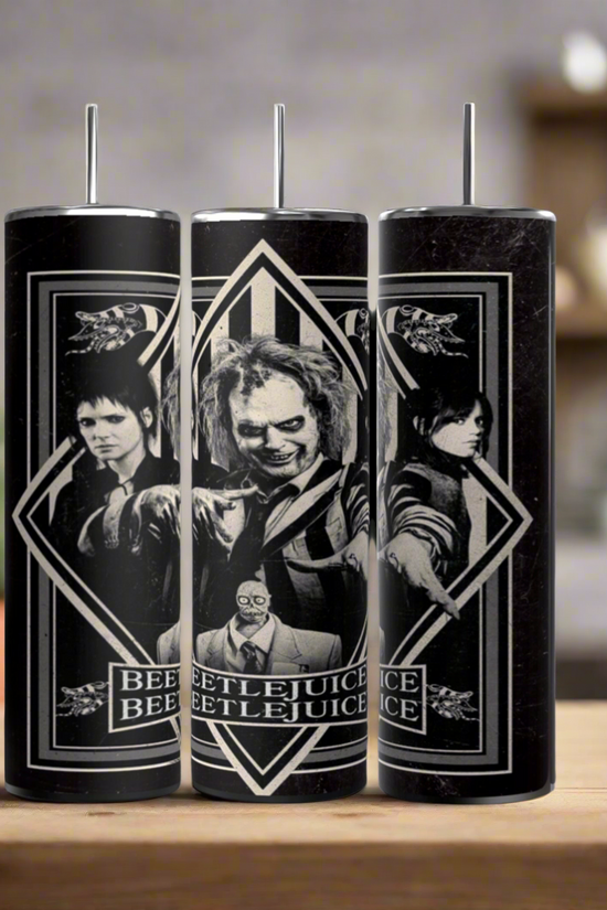 The Beetlejuice 20oz Tumbler by Kreative Kreationz features luxury-inspired black and white movie character designs, including Beetlejuice in the center, perfect for display on your kitchen counter.