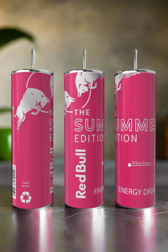 Three Summer Red Bull White Peach 20oz Tumblers by Kreative Kreationz stand upright on a kitchen counter, next to a stainless steel tumbler, with bottles and a plant blurred in the background.