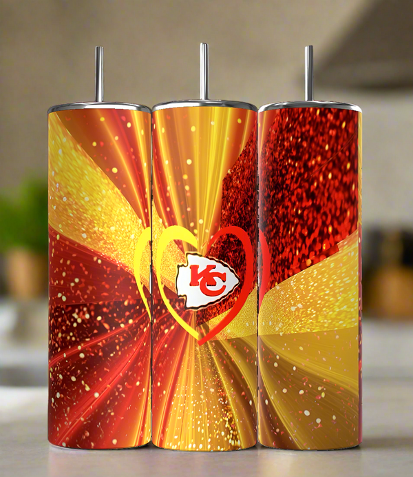 The Chiefs Heart 20oz Tumbler by Kreative Kreationz features a sparkling red and gold design with heart shapes and the team's logo—an eco-friendly must-have drinkware for Kansas City Chiefs fans.