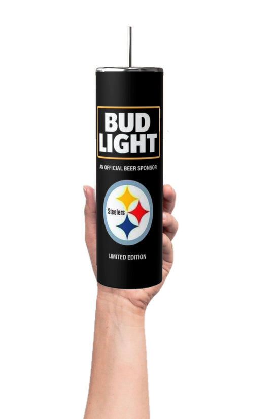 A hand holds a Kreative Kreationz 20oz Pittsburgh Steelers NFL skinny tumbler, featuring a Bud Light logo and labeled 