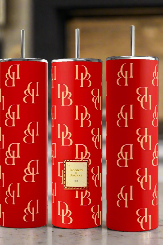Three tall, red insulated Dooney and Bourke RED 20oz Tumblers by Kreative Kreationz with double-wall insulation are shown side by side against a black background. Each tumbler features a repeating pattern of 