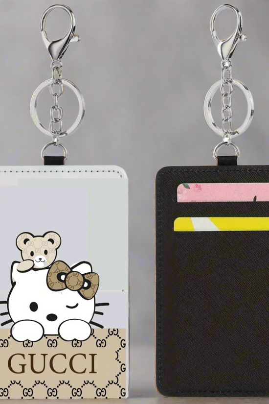 The Kreative Kreationz Card Wallet is a slim wallet keychain cardholder with a cartoon cat and teddy bear on one side and two card slots for colorful cards on the other.