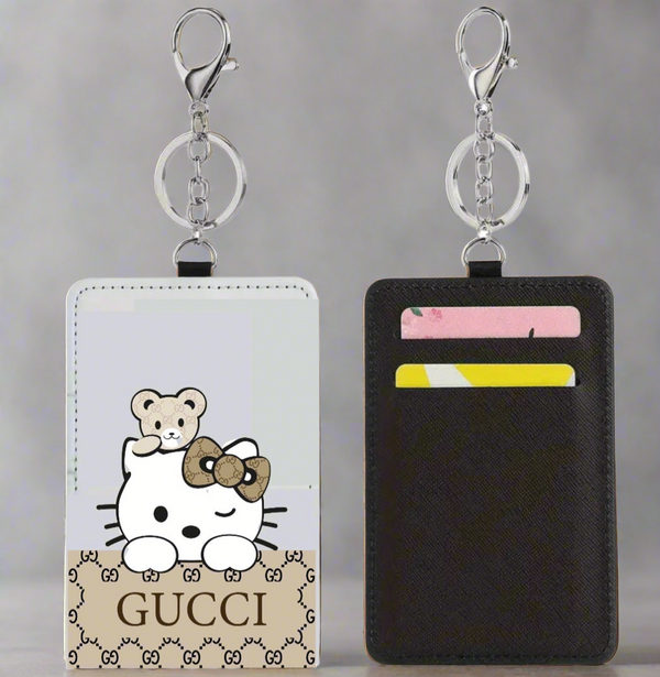 The Kreative Kreationz Card Wallet is a slim wallet keychain cardholder with a cartoon cat and teddy bear on one side and two card slots for colorful cards on the other.