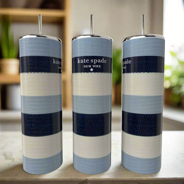 Three Kate Spade Blue Stripe 20oz Skinny Tumblers by Kreative Kreationz, featuring blue, white, and navy bands with metal straws, sit on a light surface. Each stainless steel tumbler displays the "kate spade NEW YORK" logo.