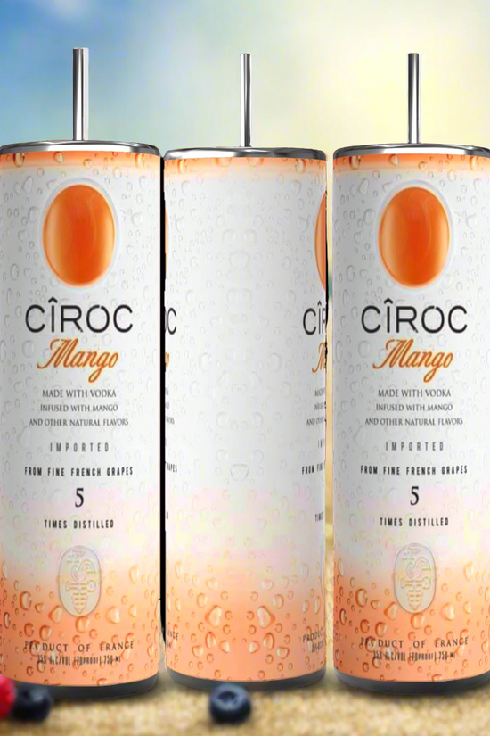 Two cans of Kreative Kreationz Ciroc 20oz Tumbler with 3D Lid Topper are shown on a wooden surface, reminiscent of travel tumblers. The left can is Red Berry flavor, topped with ice and a cherry. The right can is Vodka Snap Frost flavor, topped with ice and a lemon slice. Both cans feature product information and branding.