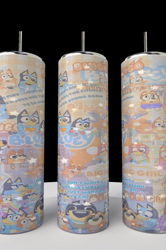 The Kreative Kreationz Bluey Collage 20oz Stainless Steel Tumblers come in a set of three with metal straws and spill-proof lids, featuring vibrant cartoon dog characters and playful patterns against a dark background.