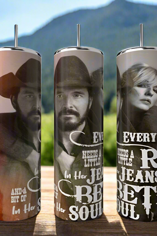 Three Kreative Kreationz Yellowstone 20oz Tumblers, featuring stainless steel and grayscale portraits of a cowboy-hatted man and woman with stylized text, are set against a scenic mountain backdrop, showcasing western-themed designs.