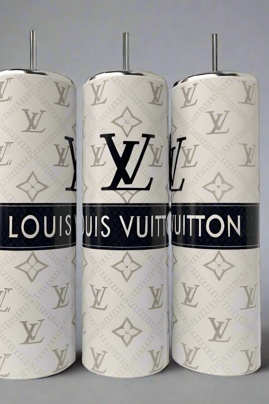 The set includes three toilet brushes mimicking luxe brand items, with white handles and patterned exteriors displaying gray logos. The central brush features 