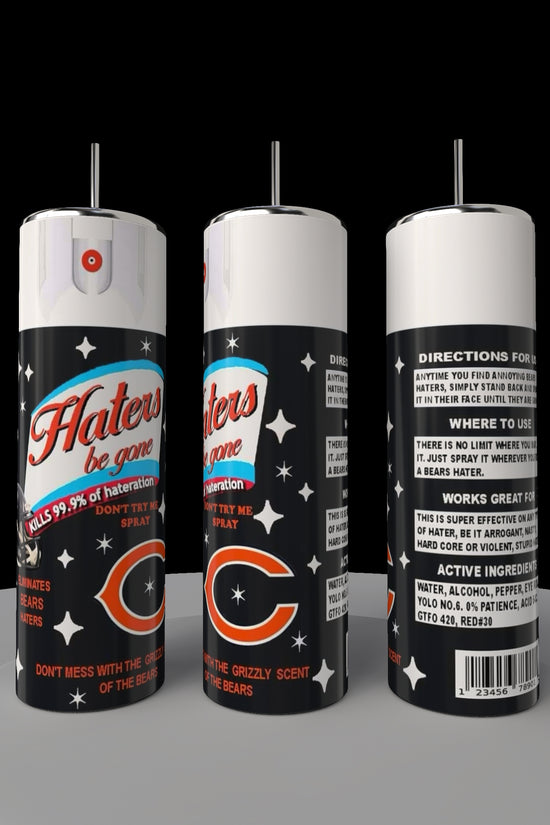 Three black aerosol cans labeled 