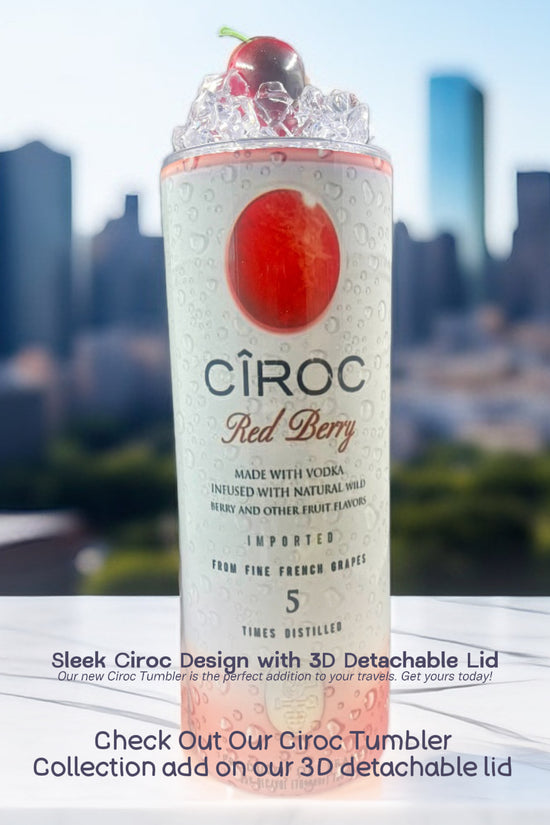 Two cans of Kreative Kreationz Ciroc 20oz Tumbler with 3D Lid Topper are shown on a wooden surface, reminiscent of travel tumblers. The left can is Red Berry flavor, topped with ice and a cherry. The right can is Vodka Snap Frost flavor, topped with ice and a lemon slice. Both cans feature product information and branding.