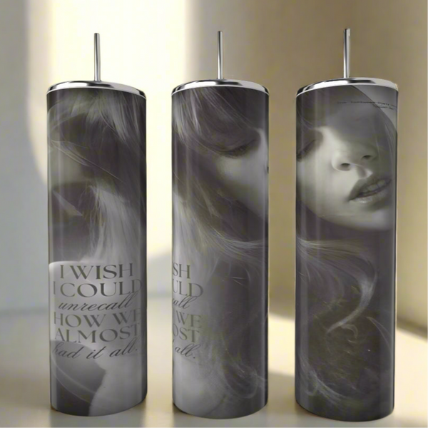 The Kreative Kreationz TTPD UNRECALL 20oz Tumbler features a black-and-white woman's face, "I WISH I COULD unrecall HOW WE ALMOST had it all" text, a metal straw, and a spill-proof lid for convenience.