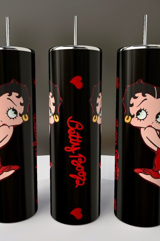 Three tall, cylindrical Betty B White 20 oz Skinny Tumblers by Kreative Kreationz feature a black backdrop with Betty Boop in a red dress and heels. The design pops with 