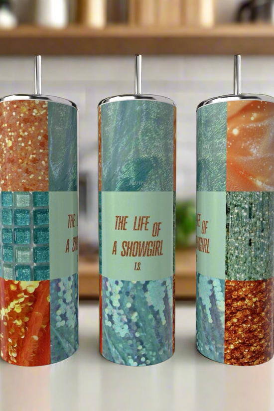 Three 20oz “The life of a Showgirl Aesthetic Taylor Swift” tumblers by Kreative Kreationz, each handcrafted with eco-friendly materials, metal straws, and adorned with colorful, glittery mosaic patterns, sit on the kitchen counter.