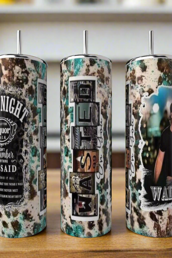 Three tall, stainless steel Kreative Kreationz tumblers with a rustic speckled design and unique text graphics are displayed indoors on a wooden surface. One is the Morgan Wallen 20oz Tumbler featuring his photo.