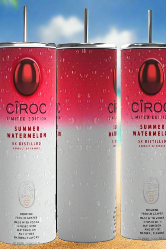 Two cans of Kreative Kreationz Ciroc 20oz Tumbler with 3D Lid Topper are shown on a wooden surface, reminiscent of travel tumblers. The left can is Red Berry flavor, topped with ice and a cherry. The right can is Vodka Snap Frost flavor, topped with ice and a lemon slice. Both cans feature product information and branding.
