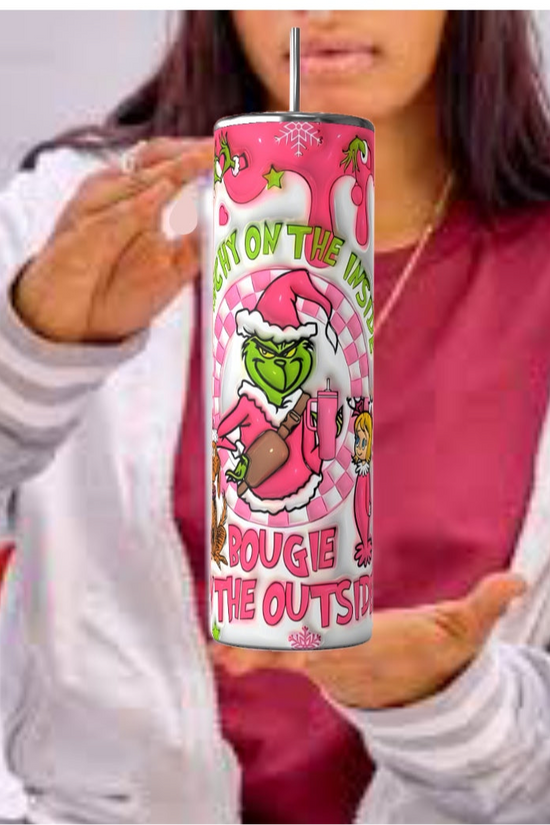 In a casual outfit, a person holds a vibrant can featuring a cartoon character in a Santa suit, highlighting the text 