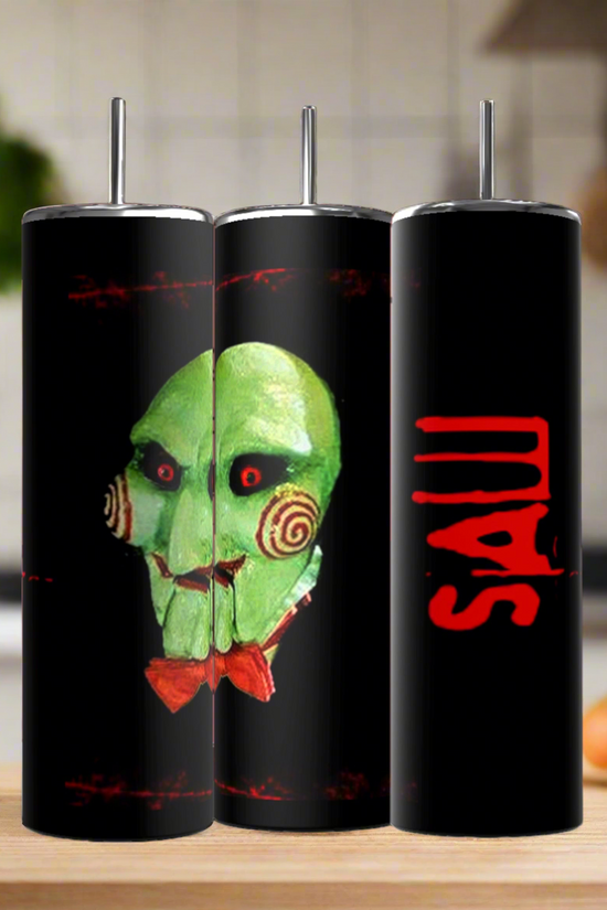 Three Billie The Puppet 20oz Tumblers by Kreative Kreationz are displayed—two with the green SAW puppet face, one with a red 